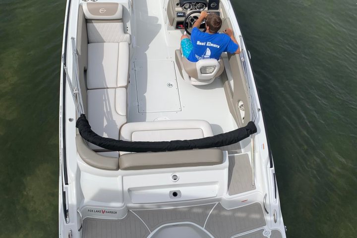 a boat sitting on top of a suitcase