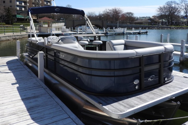 a boat is docked next to a body of water