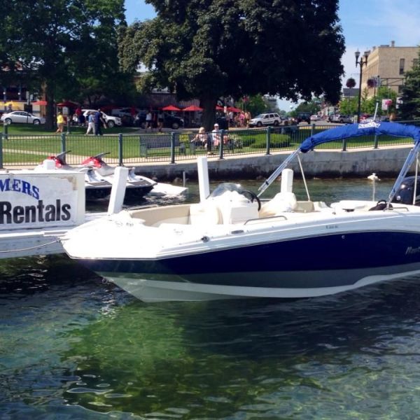 a group of people on a boat in the water